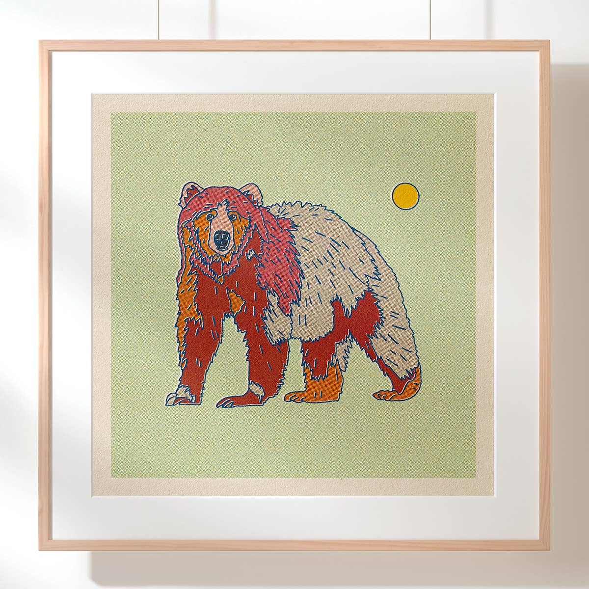 A print of a bear framed