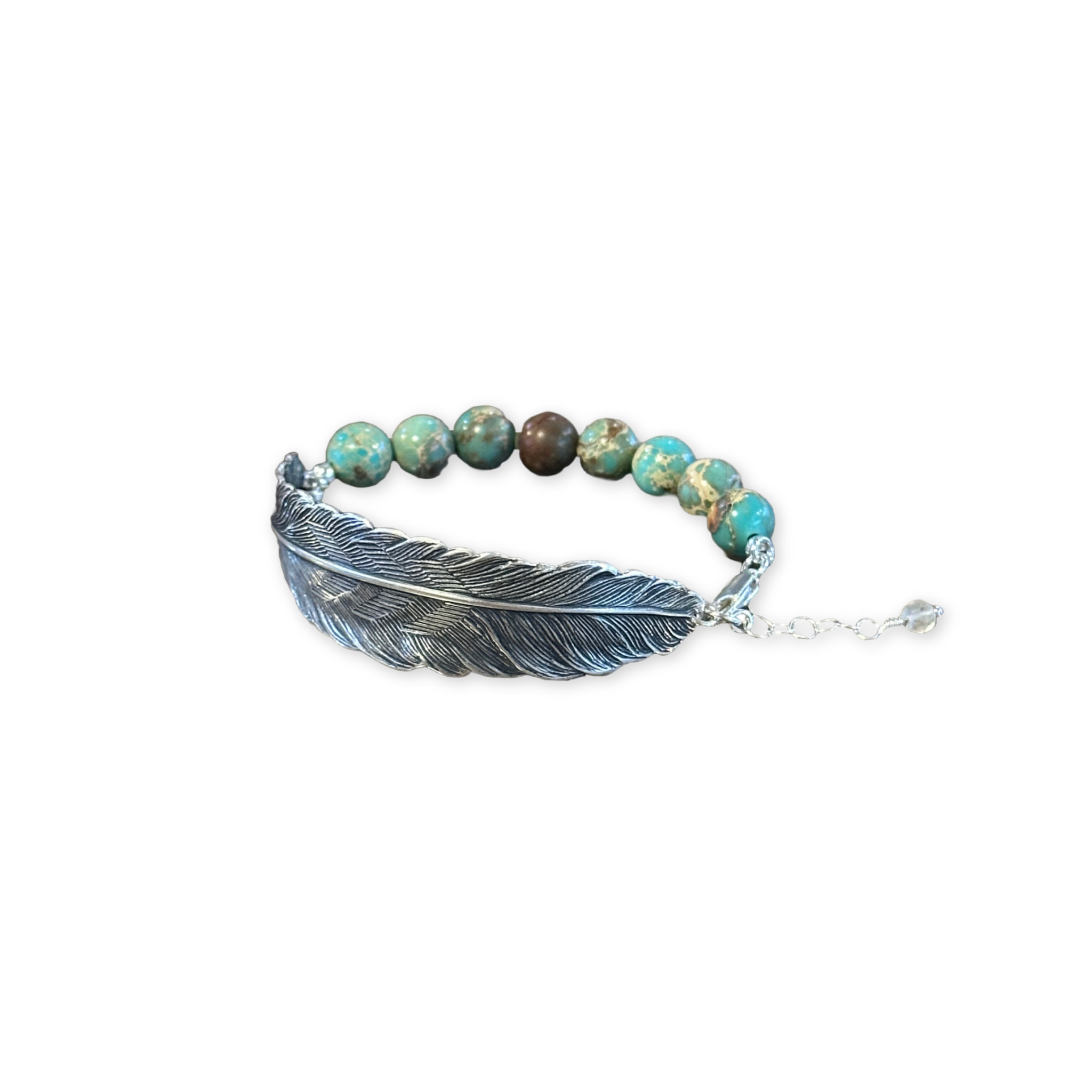 a bracelet with turquoise beads and a silver feather