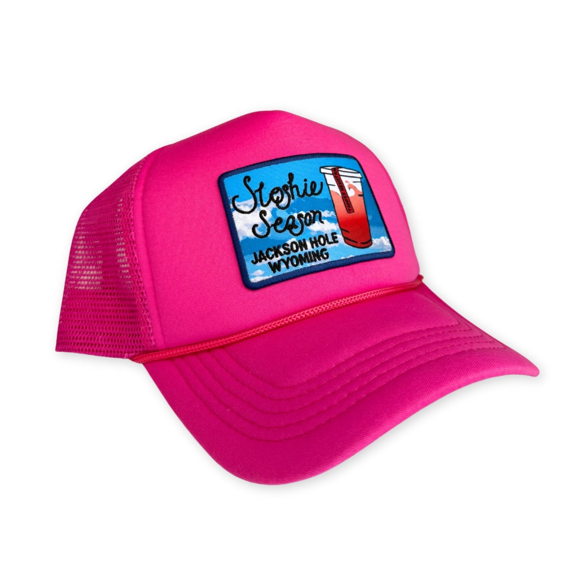 Pink trucker hat with a patch on a white background