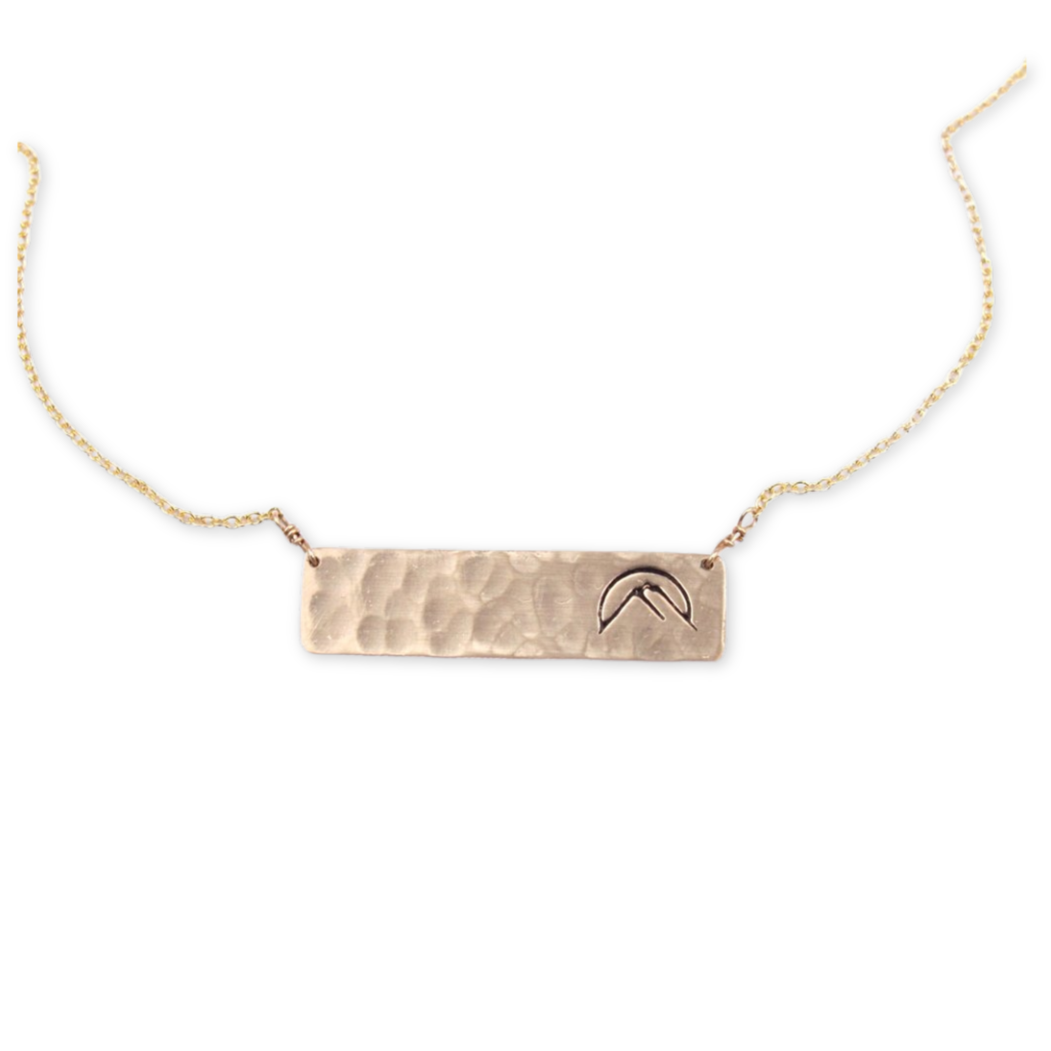hammered rectangle pendant with stamped mountain design hanging from a delicate necklace chain