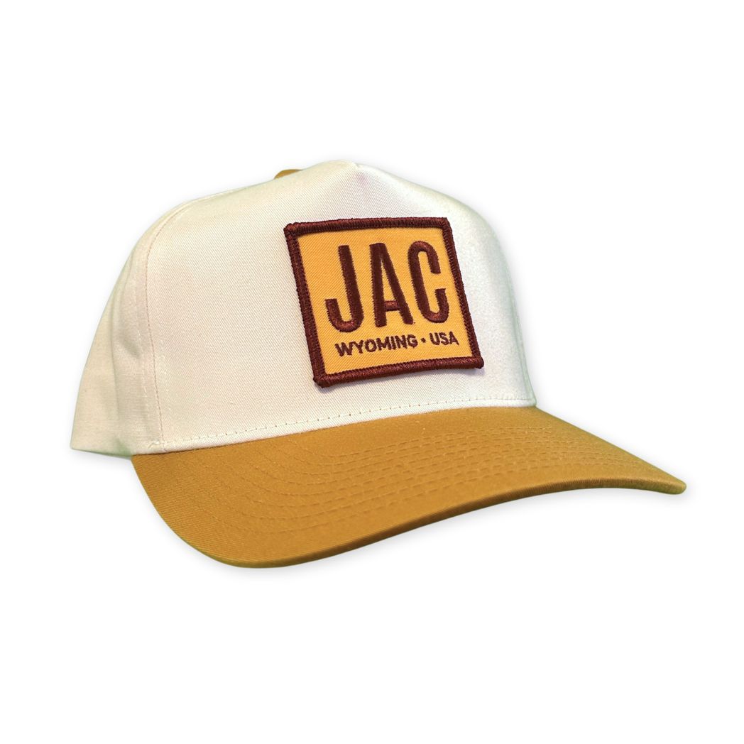 Cap with 'JAC Wyoming USA' patch on a white background