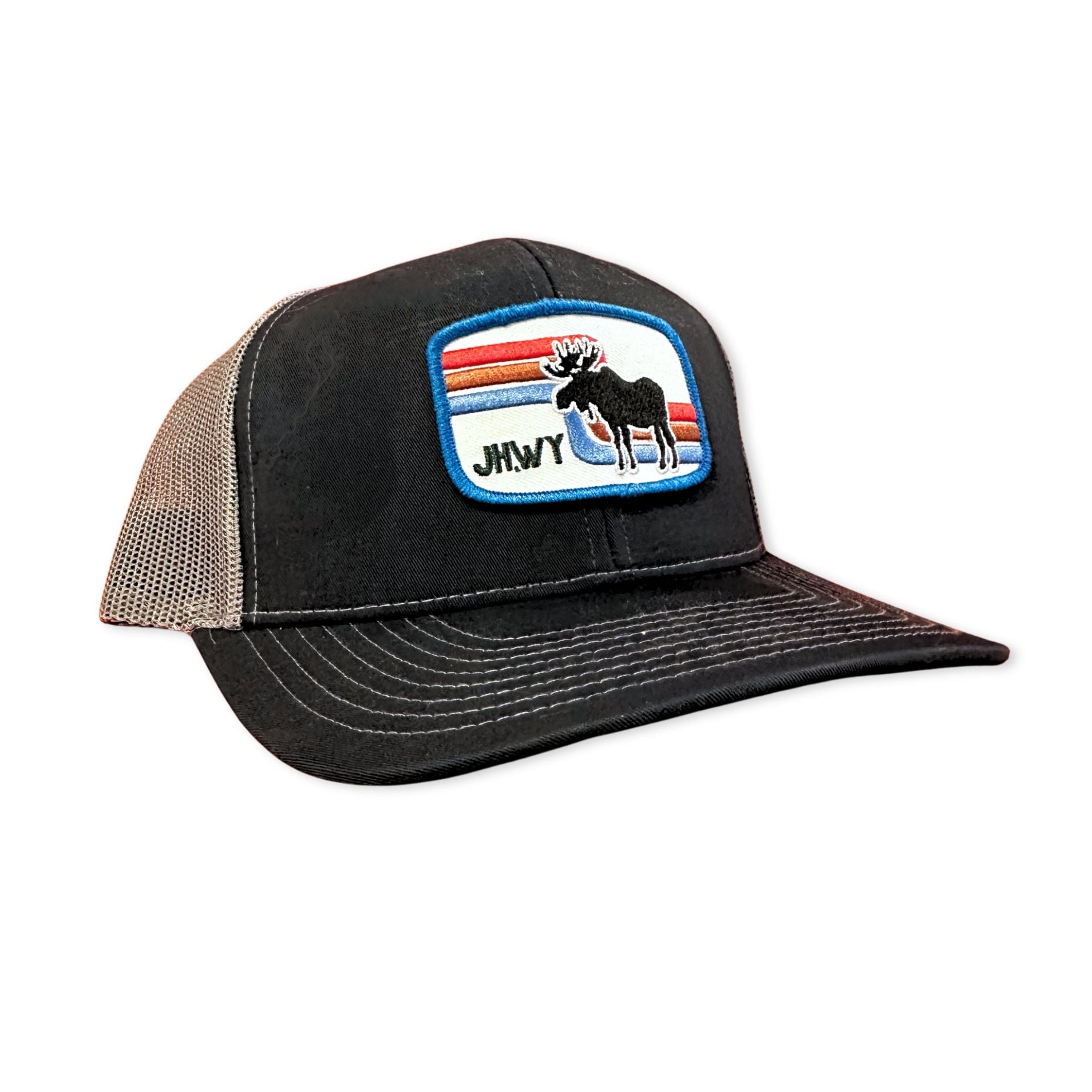 Black trucker hat with retro moose patch featuring text JH.WY