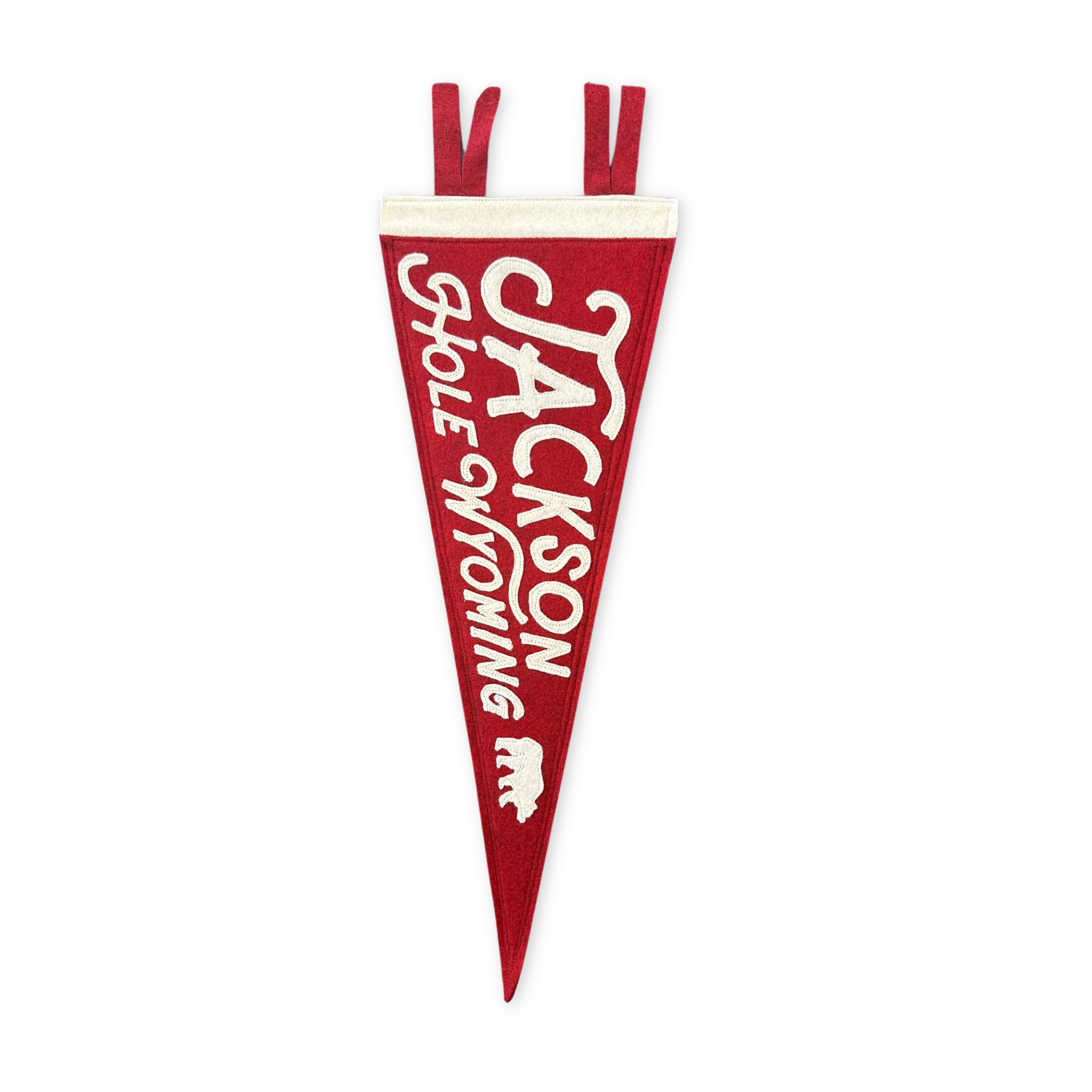 stitched felt pennant featuring a small bear and the words jackson hole wyoming