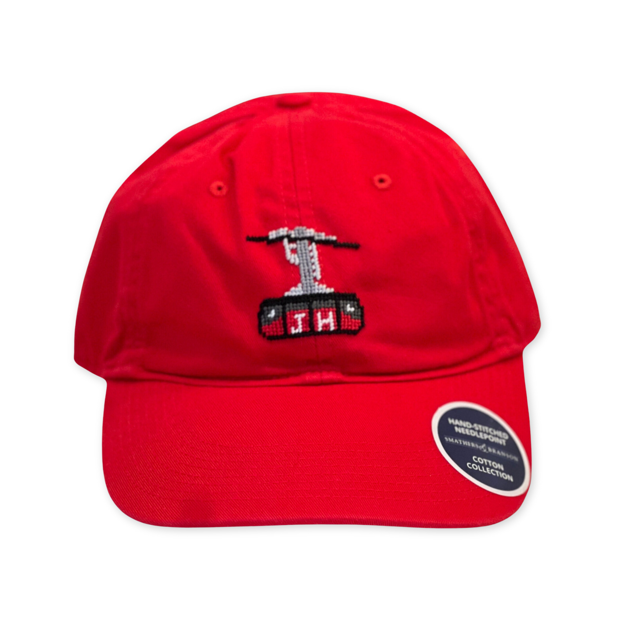 cotton colored baseball cap with hand stitched needlepoint tram logo