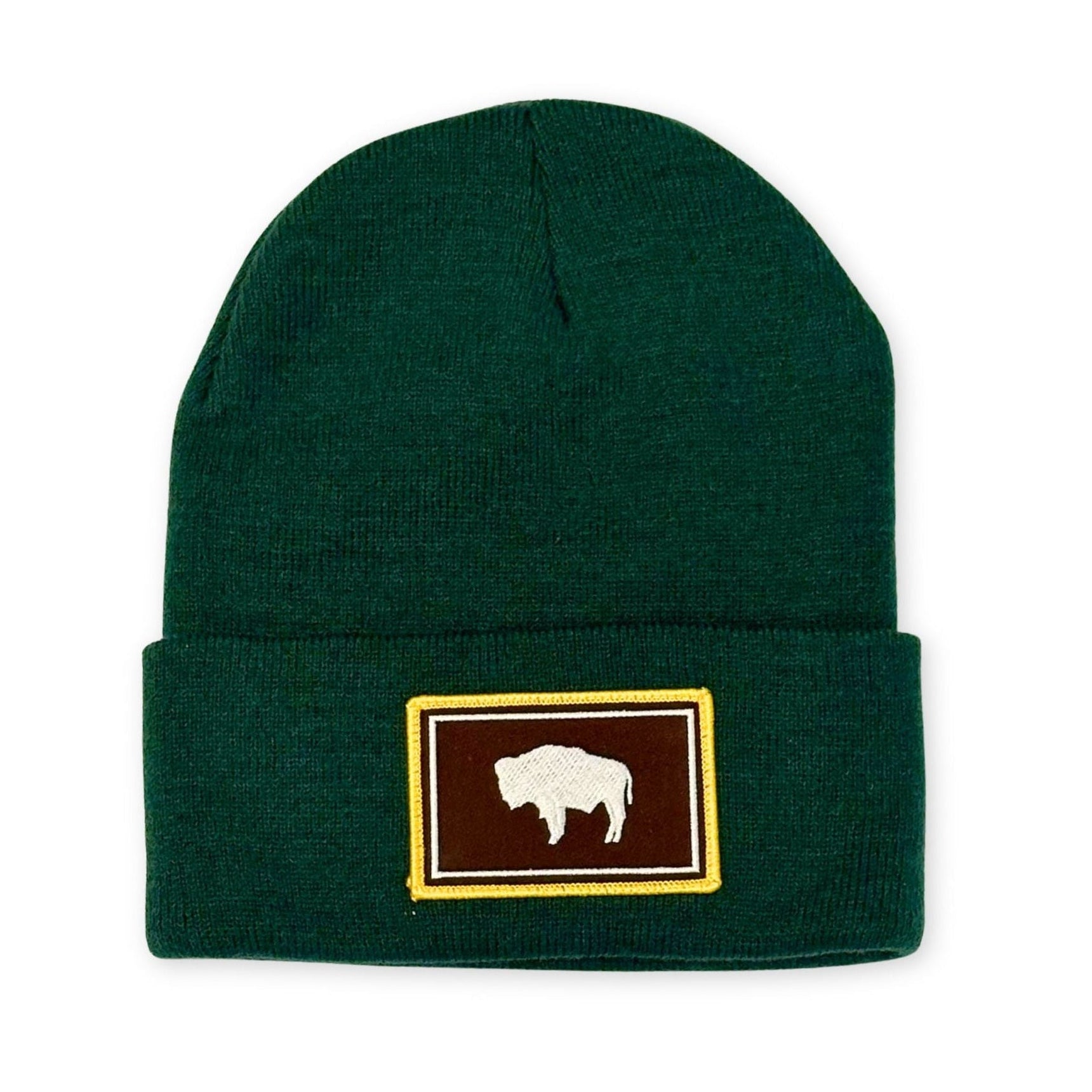 Forest green beanie with brown, yellow, and white Wyoming Flag square patch.