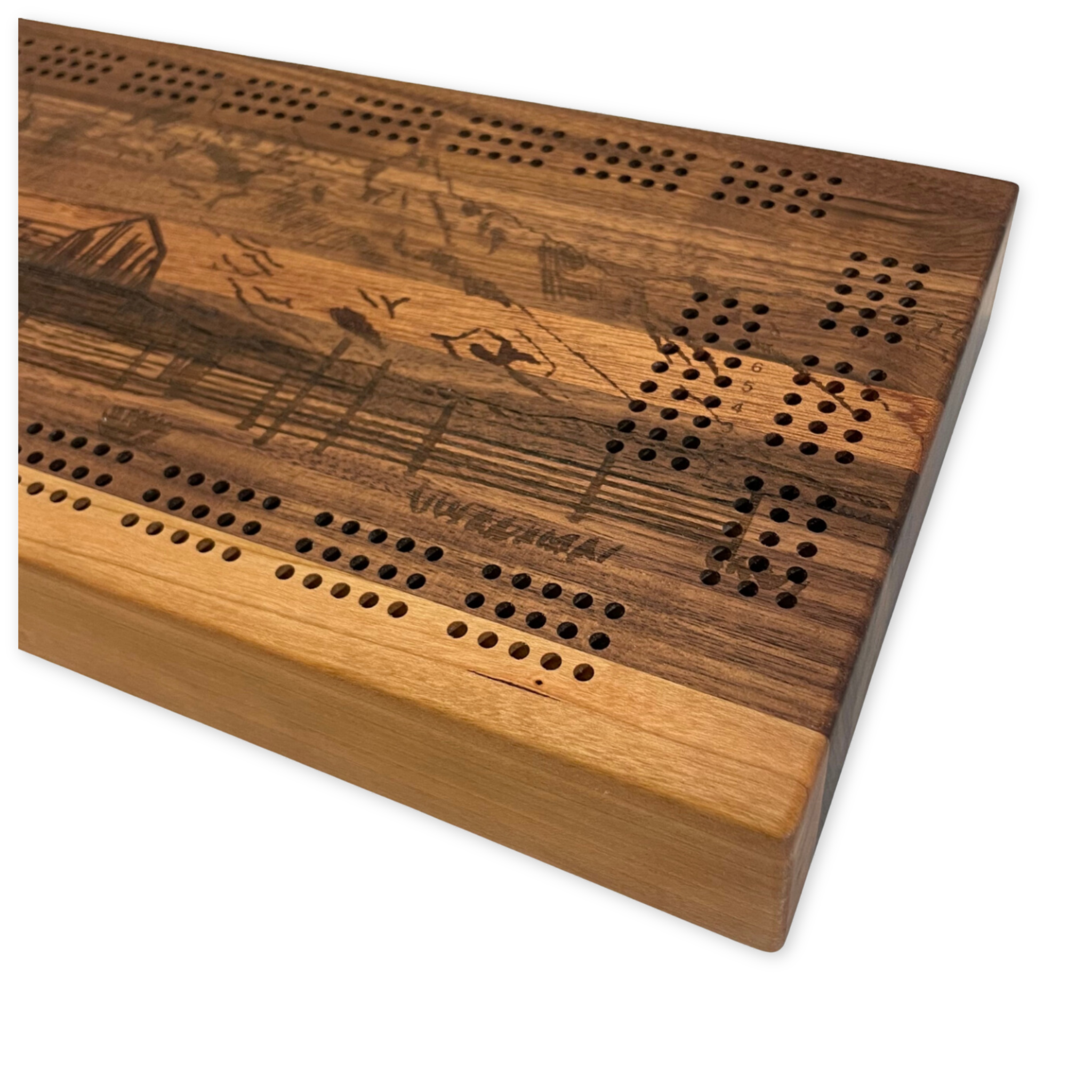 handcrafted wooden cribbage board featuring a design depicting mormon row in jackson hole