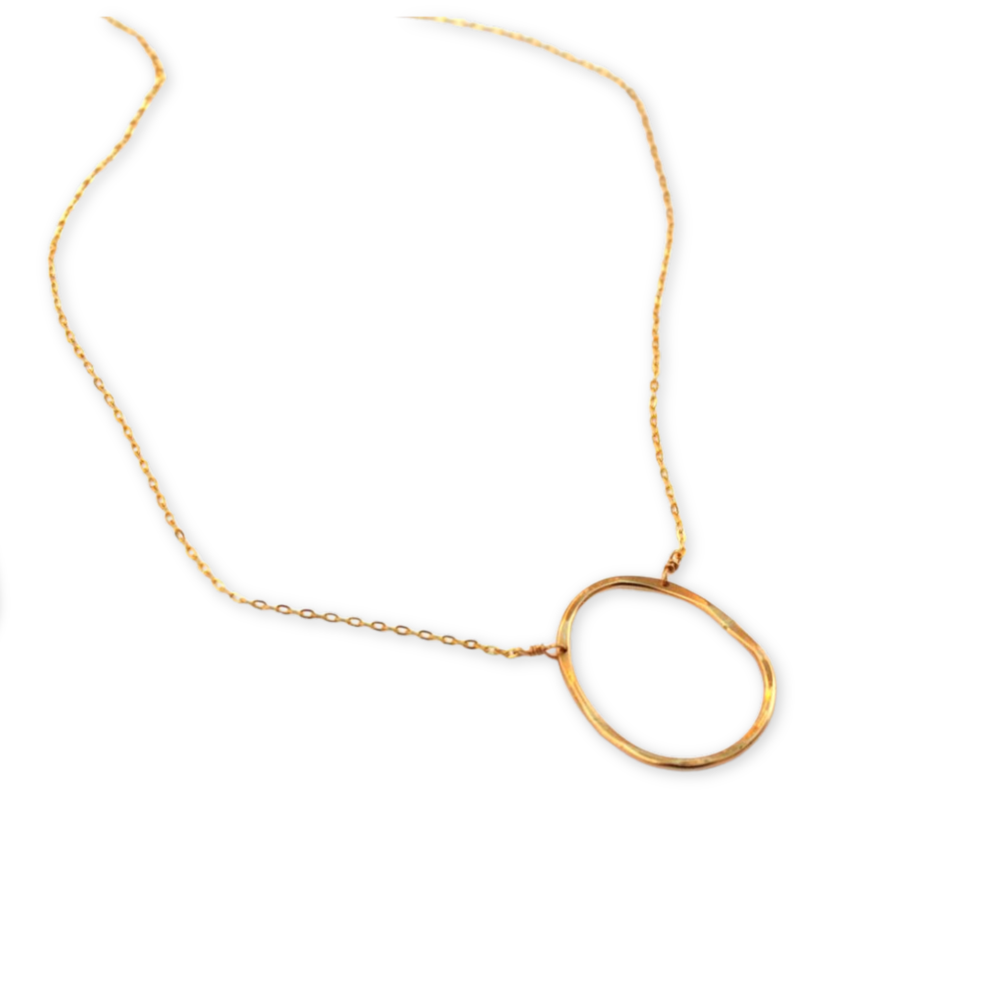 hand forged oval pendant hanging on a delicate necklace chain