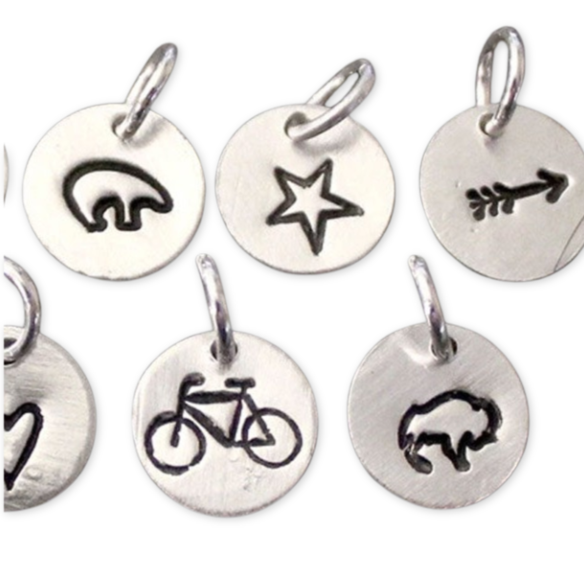 silver charms with stamped images
