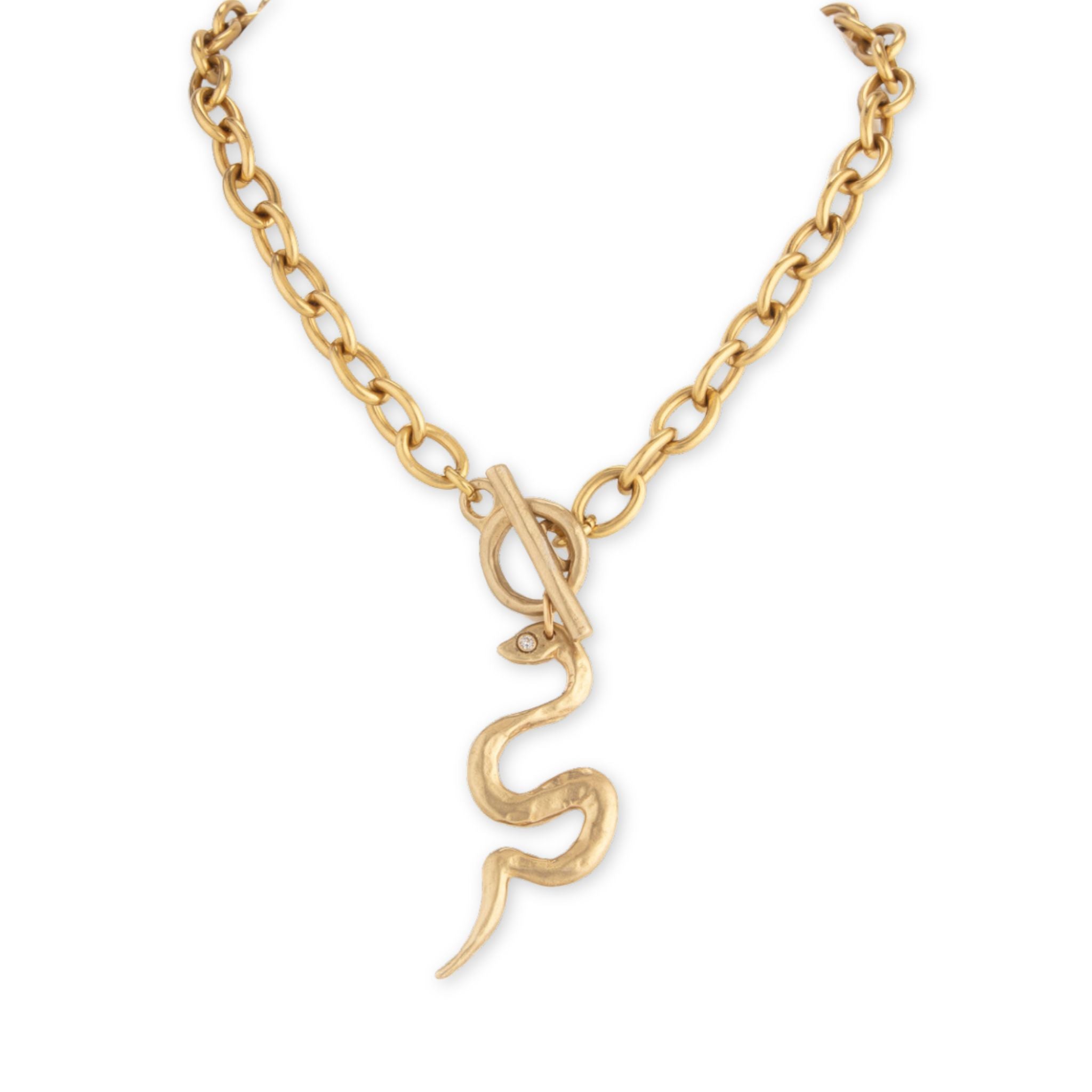 Gold snake-shaped pendant on a chain against a white background