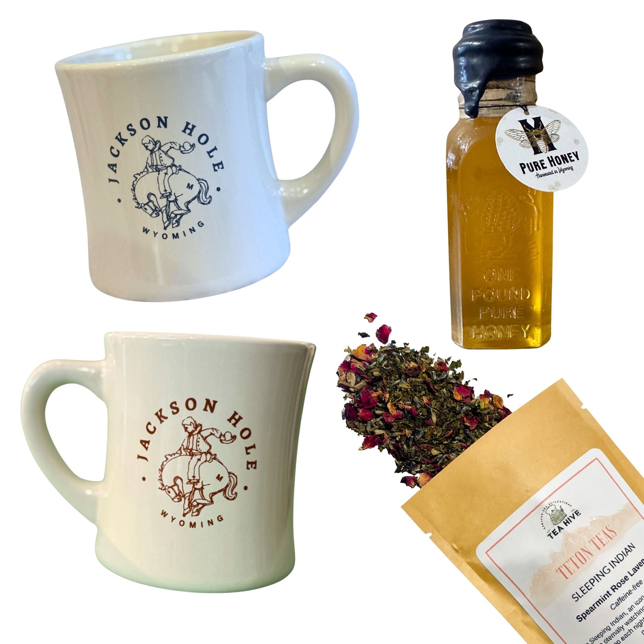 Two mugs with 'Jackson Hole Wyoming' design, a bottle of honey, and a package of tea on a white background.