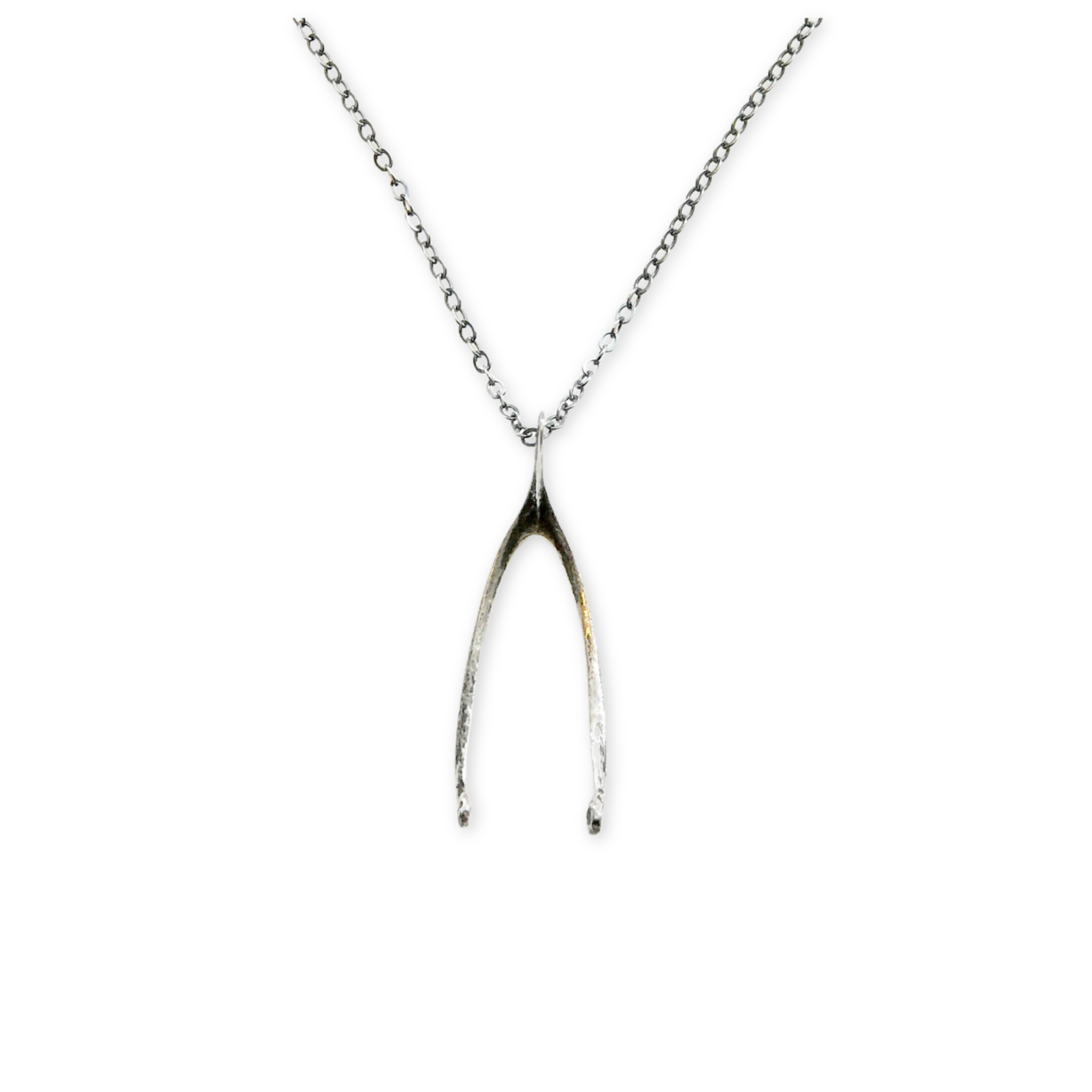 silver wish bone hanging on a necklace chain