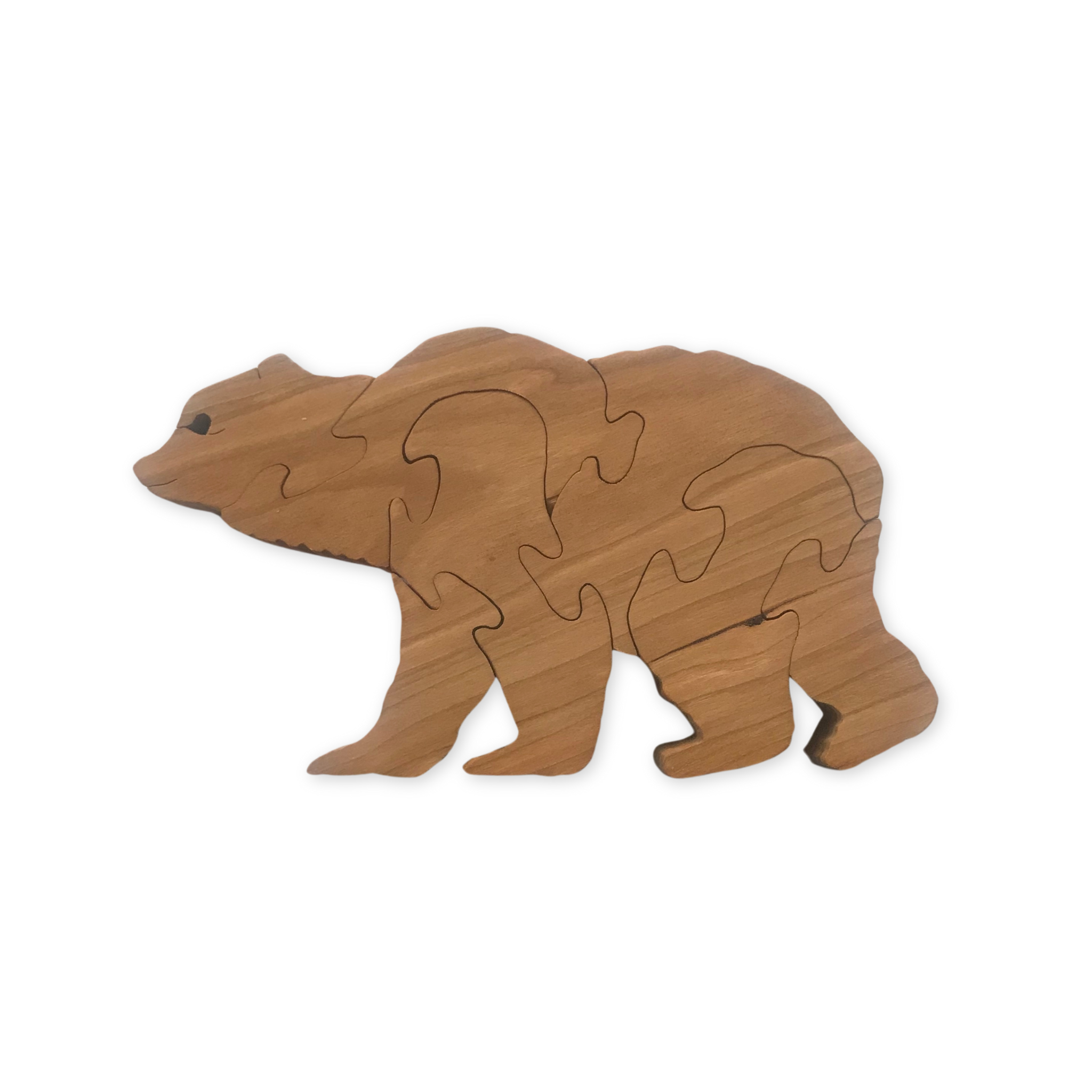 handcrafted wooden puzzle in the shape of a bear