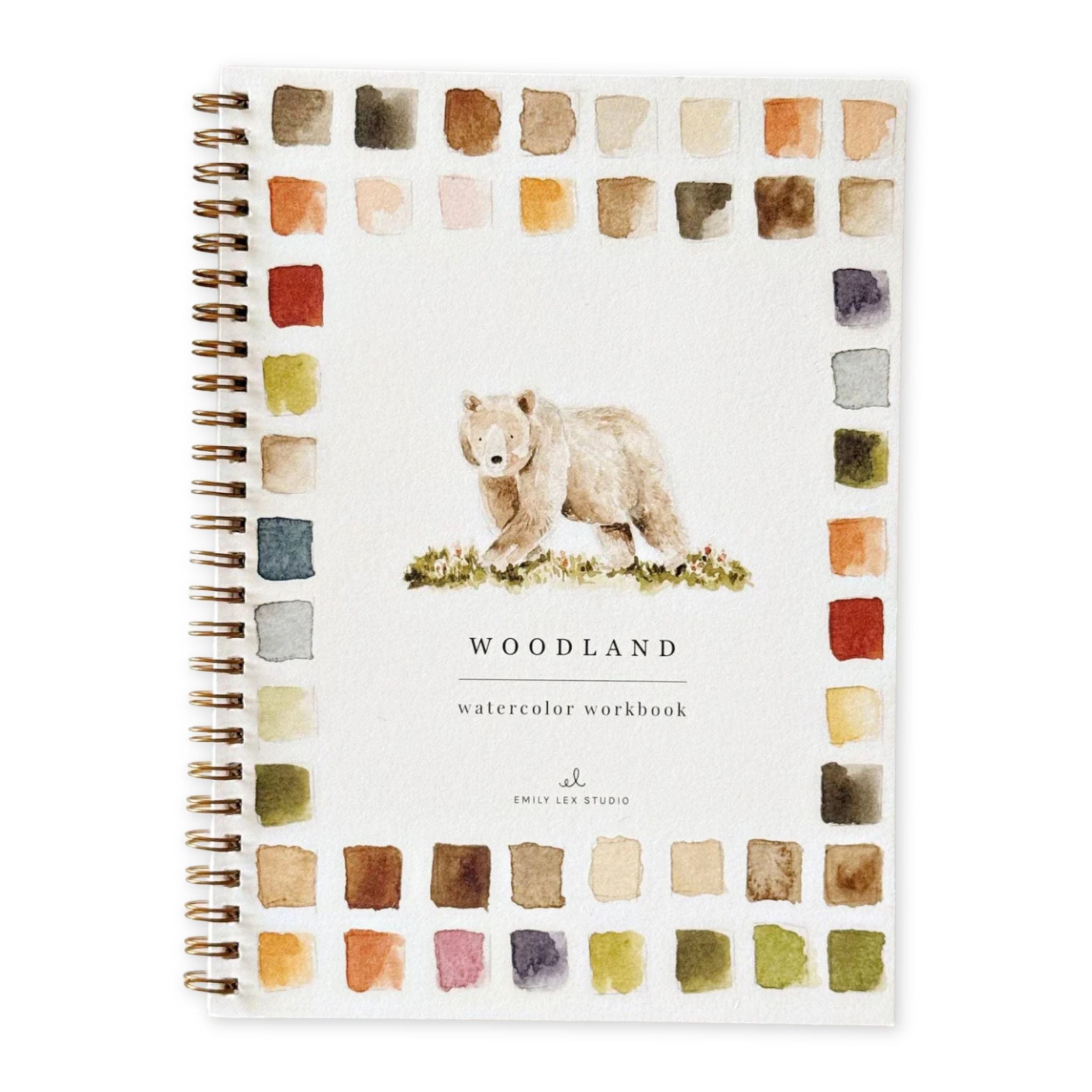 Watercolor workbook with bear illustration and color swatches on a white background