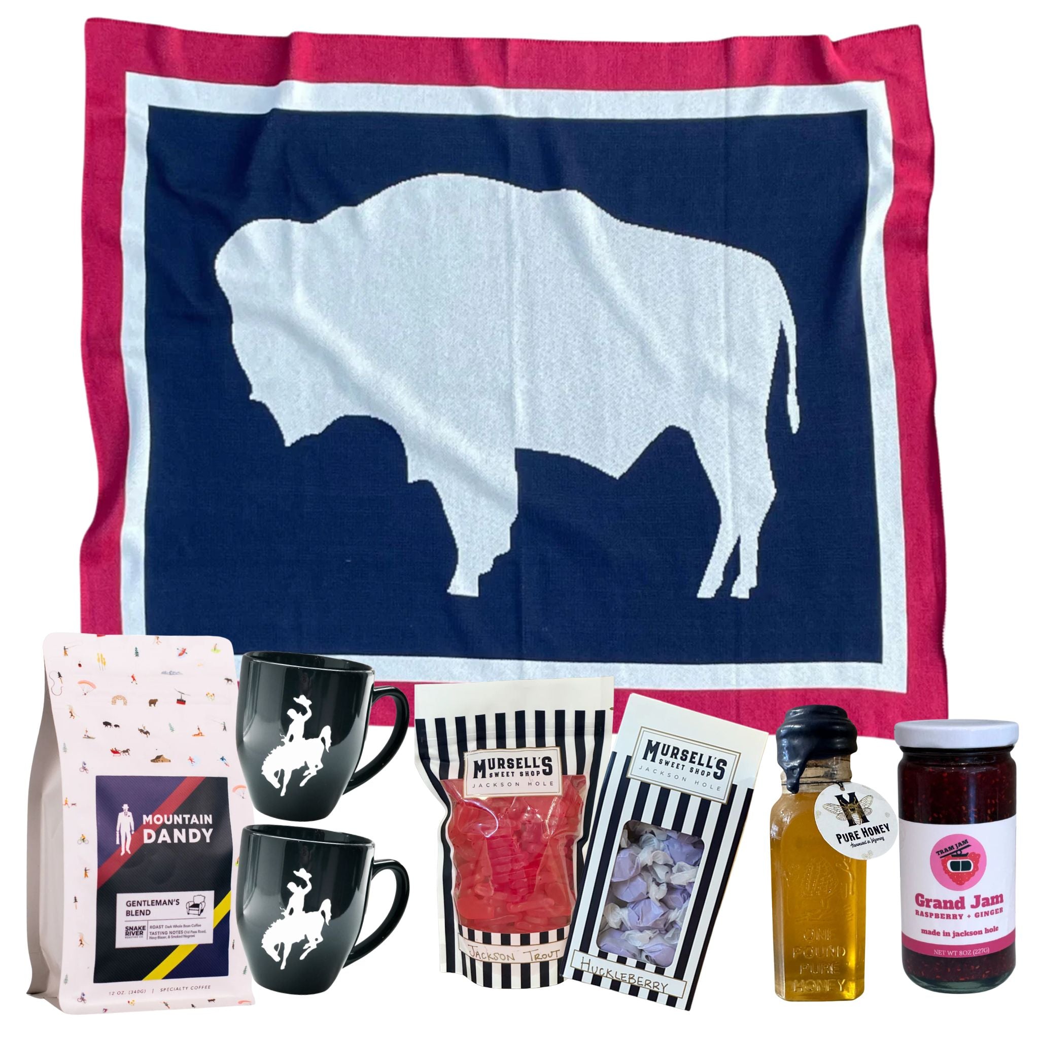 Collection of items including a towel with a bison design, mugs, a jar of jam, and other products on a white background.