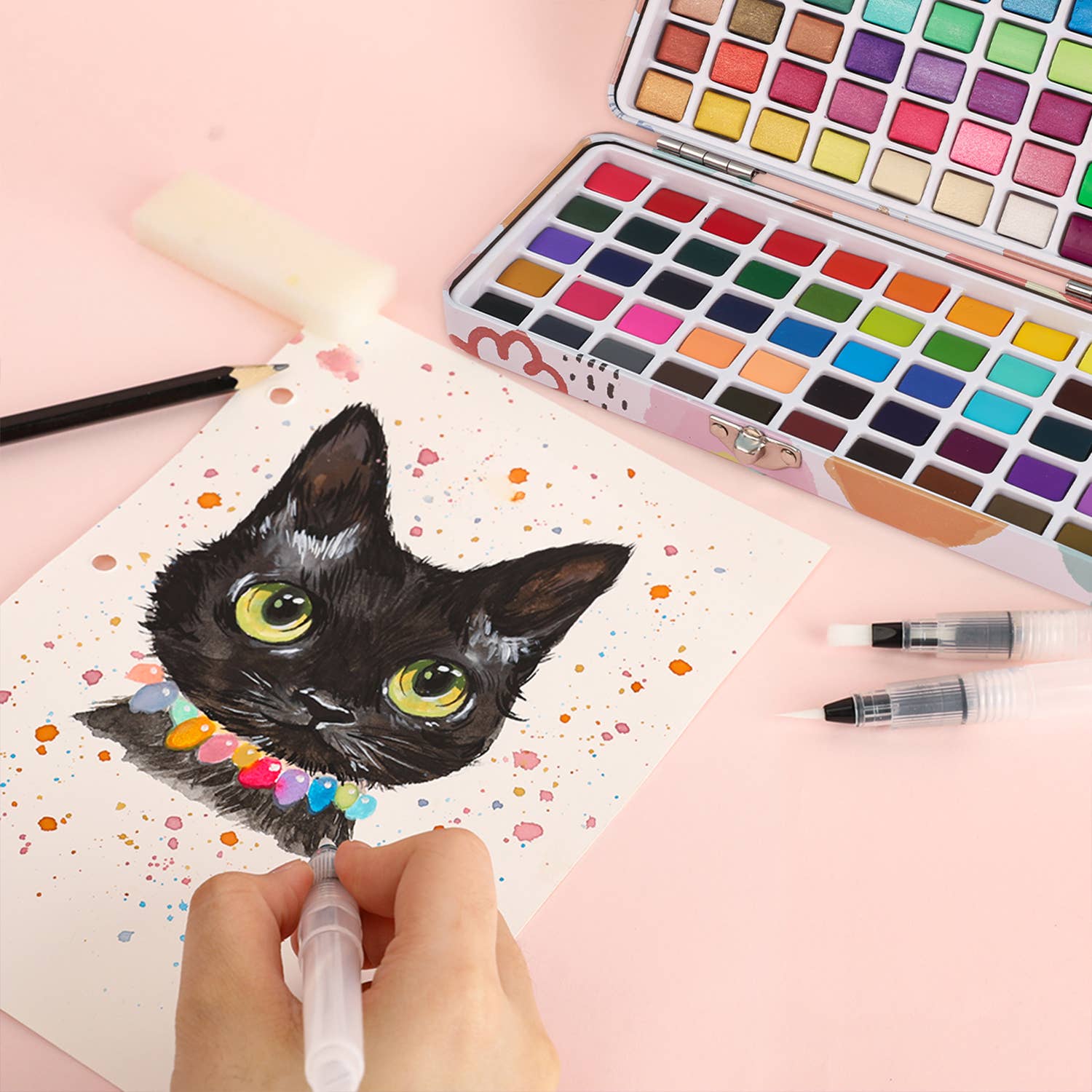 Artistic illustration of a black cat with colorful details on a pink background, surrounded by watercolor paints and brushes.