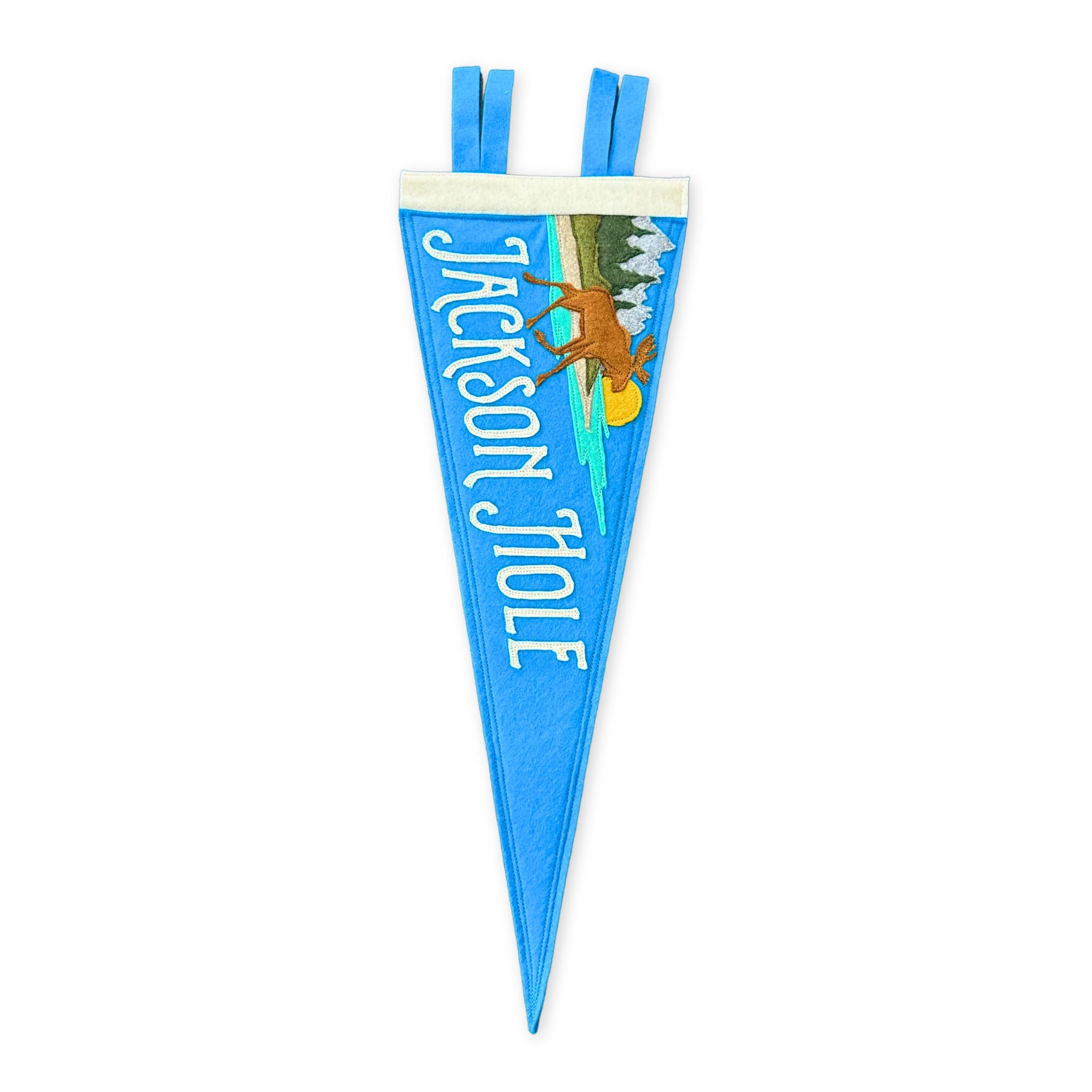 stitched felt pennant featuring the teton mountain range and a moose walking into water