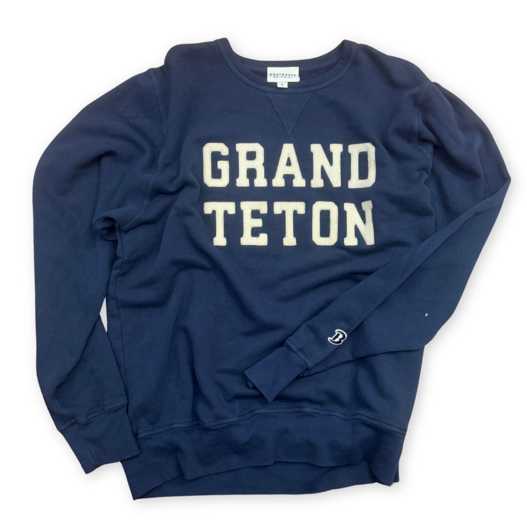 Navy blue sweatshirt with 'Grand Teton' text on a white background