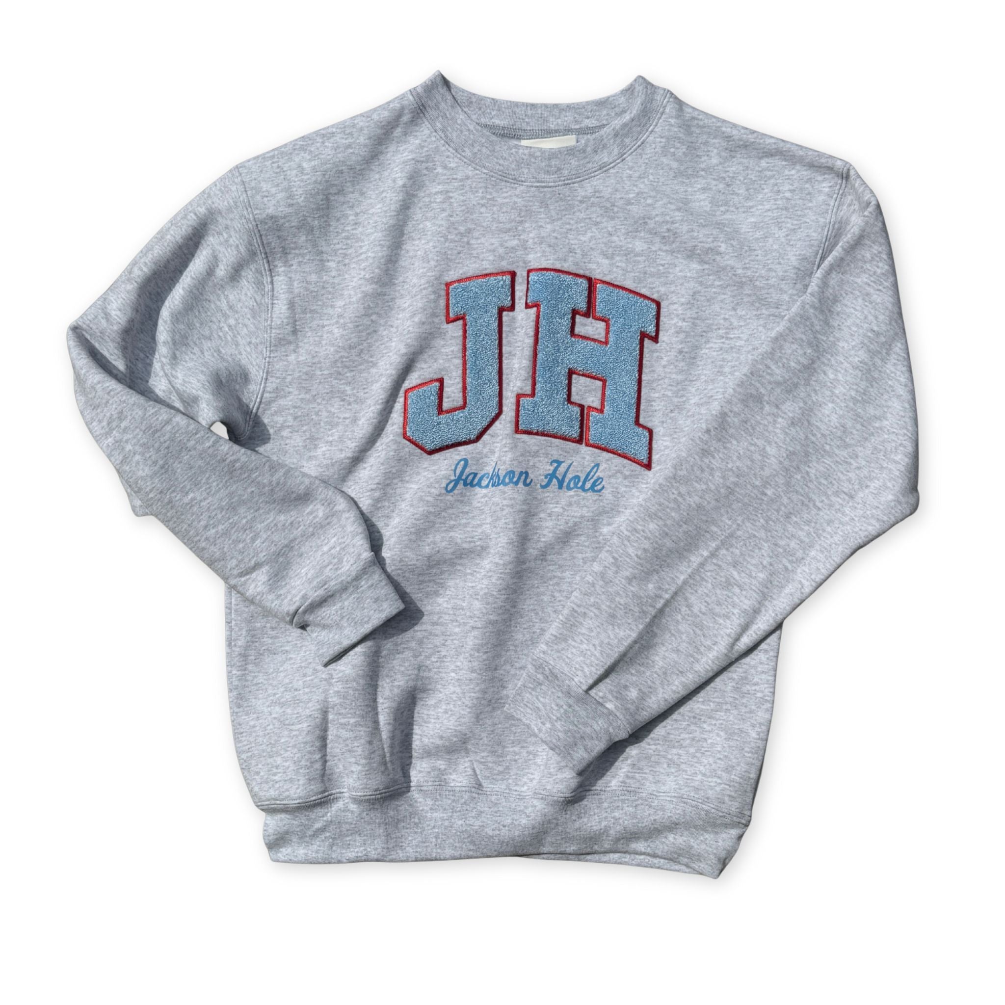 Gray sweatshirt with 'JH' and 'Jackson Hole' text 