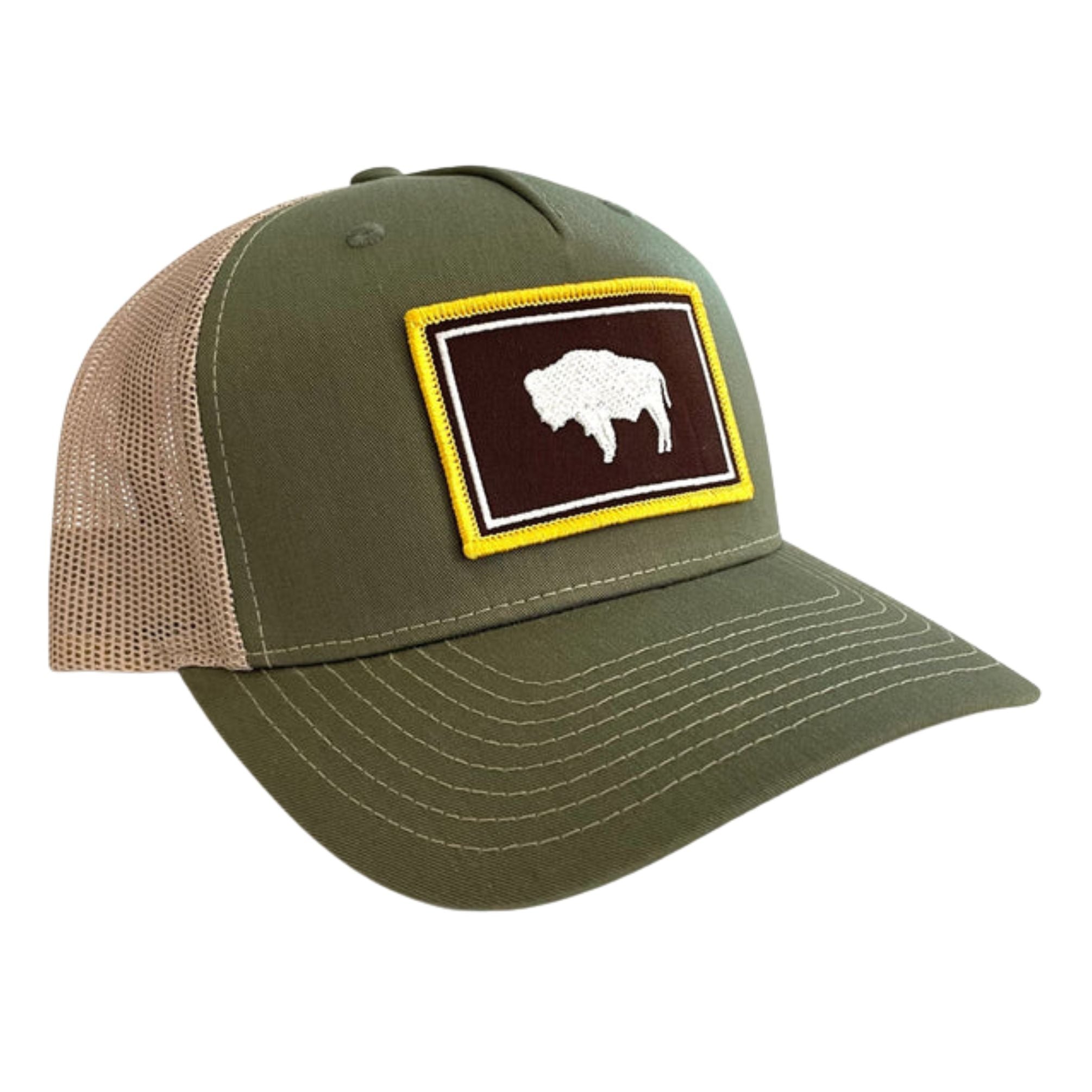 A moss green trucker hat with the wyoming flag in brown and gold