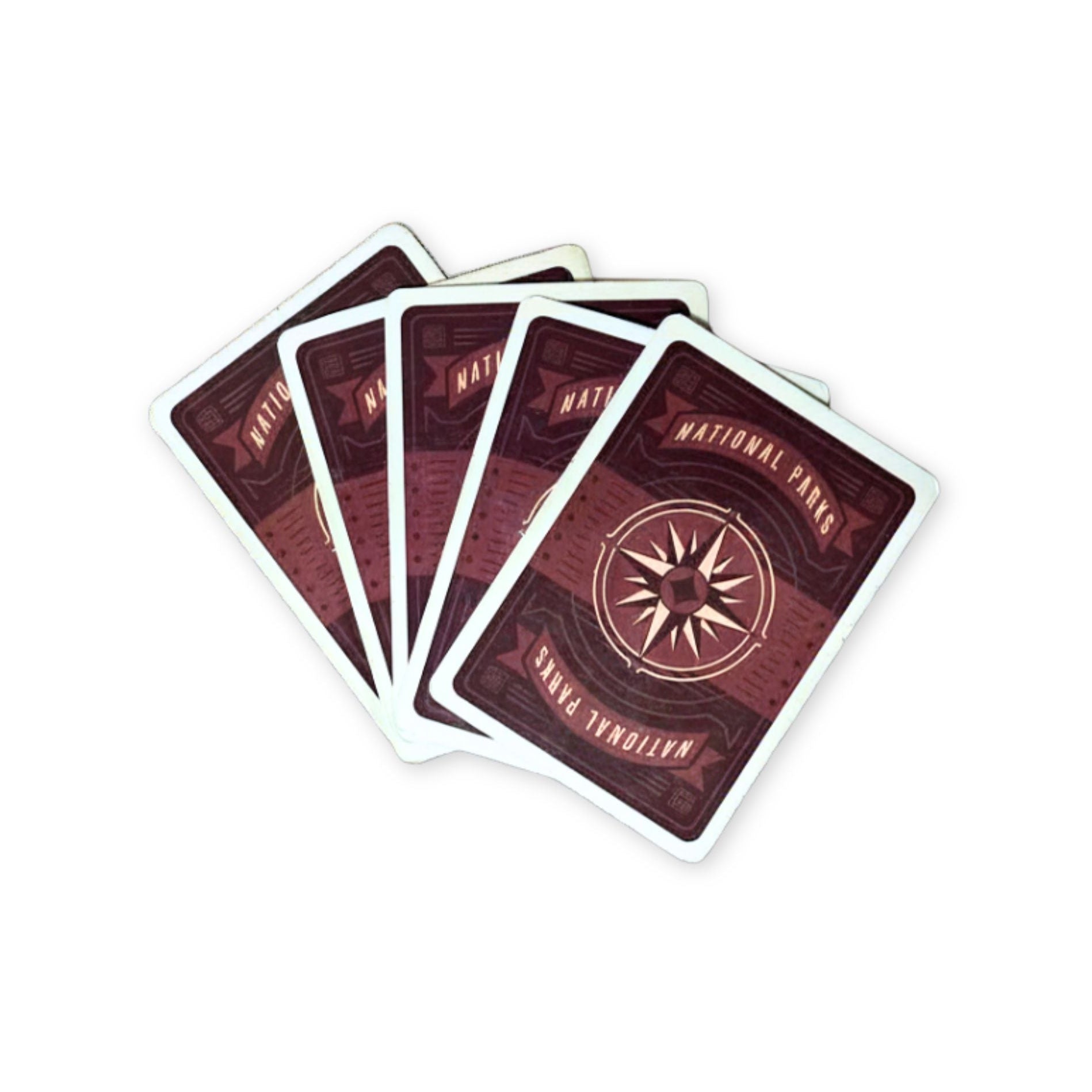 Set of playing cards with a compass design on a white background