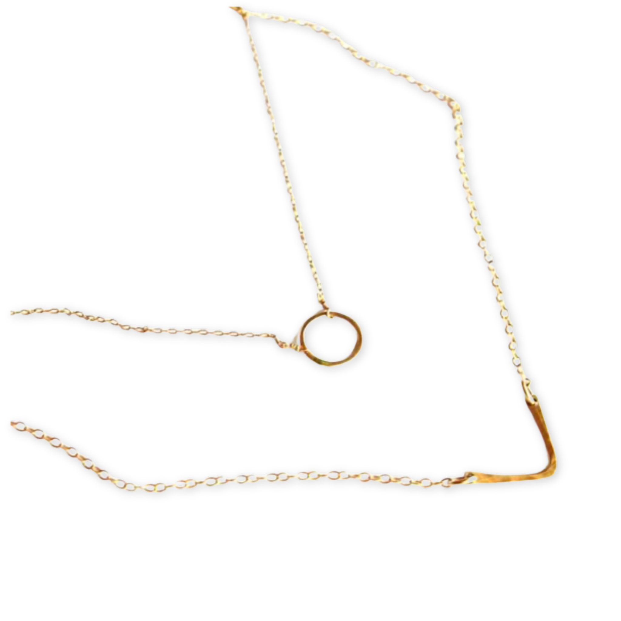 a layered necklace with a hammered circle and v