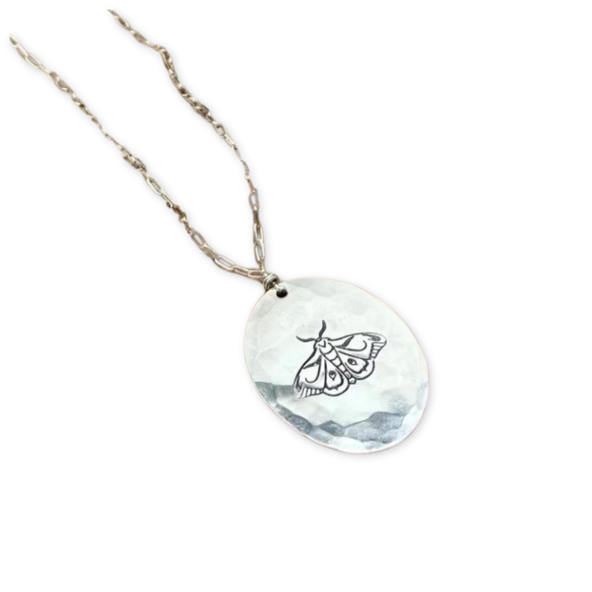 necklace with a hammered oval pendant with a stamped month on a chain
