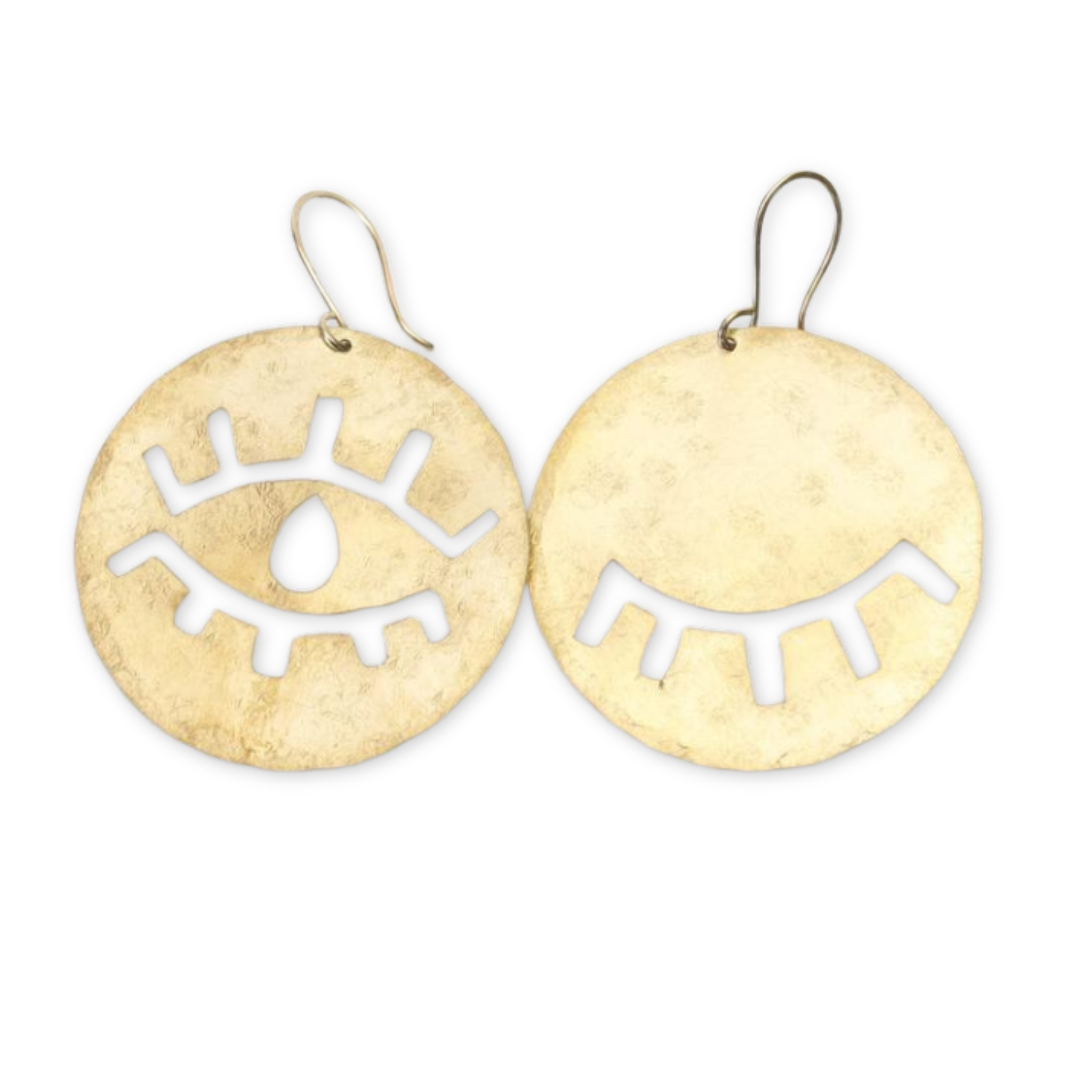 a pair of gold earrings with an open and closed eye design