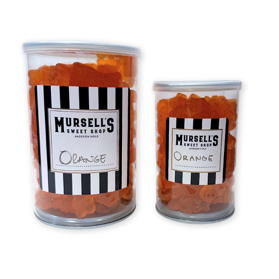 Small and Large jars of orange flavored gummi bears from Mursell's Sweet Shop.