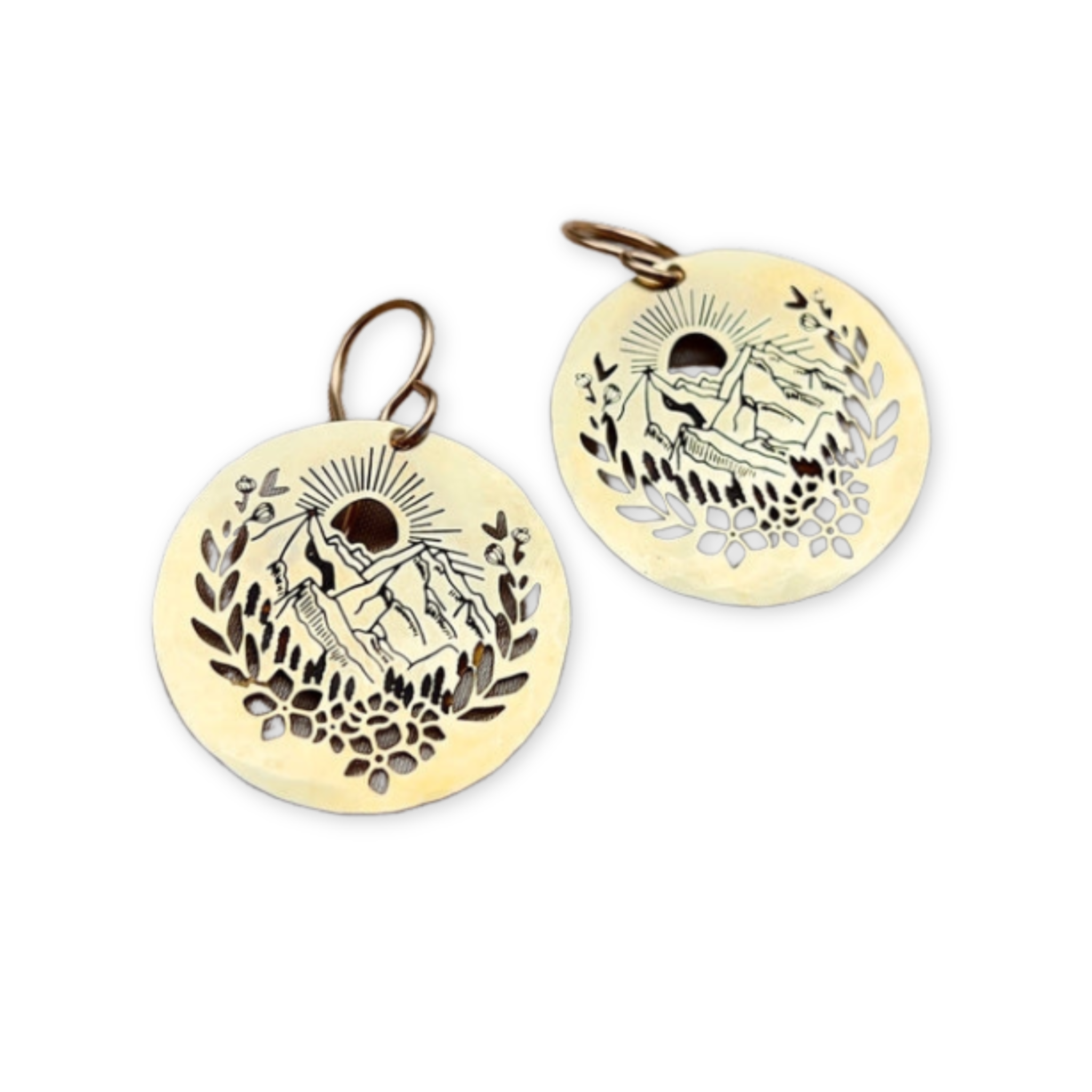 disc shaped earrings with mountains and nature scene