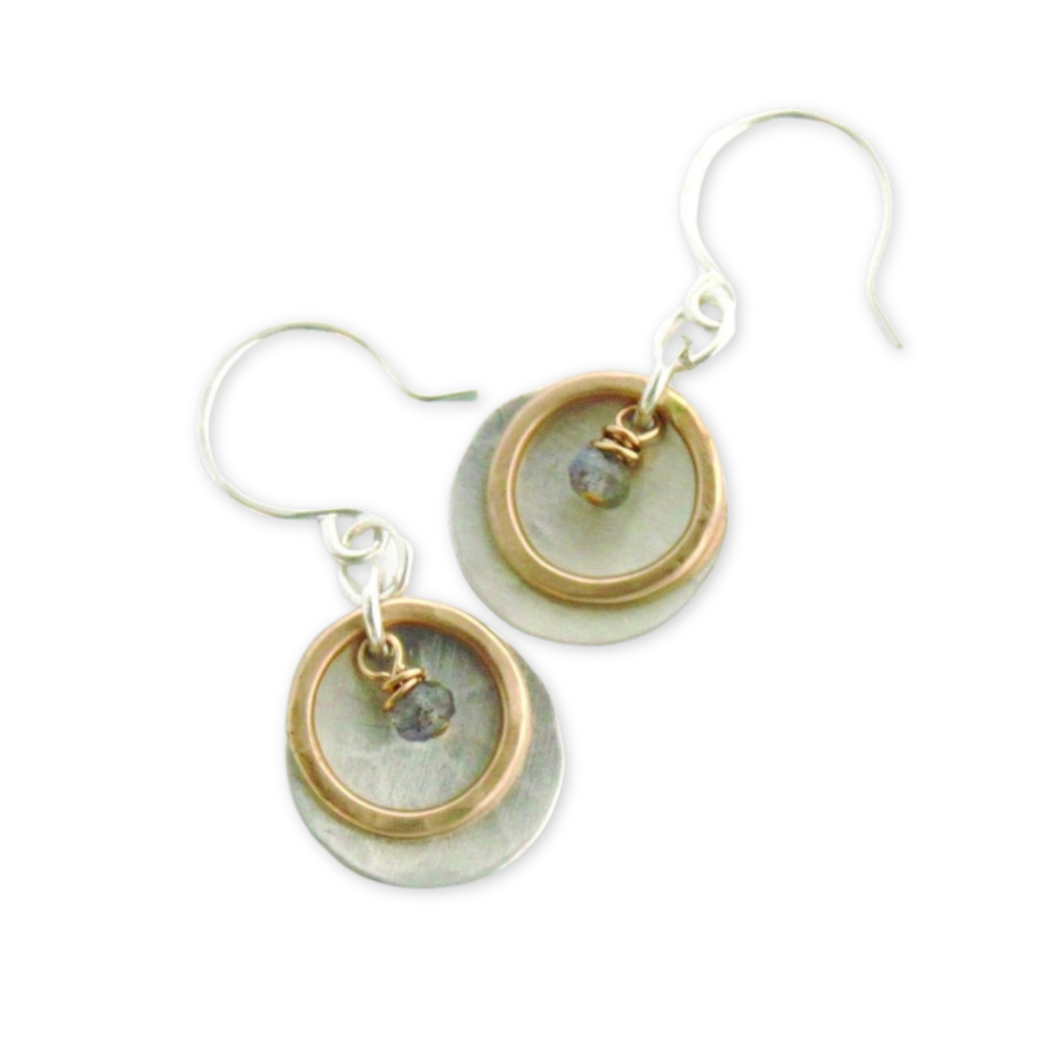 a pair of earrings with a round disc and a circle and a hanging bead