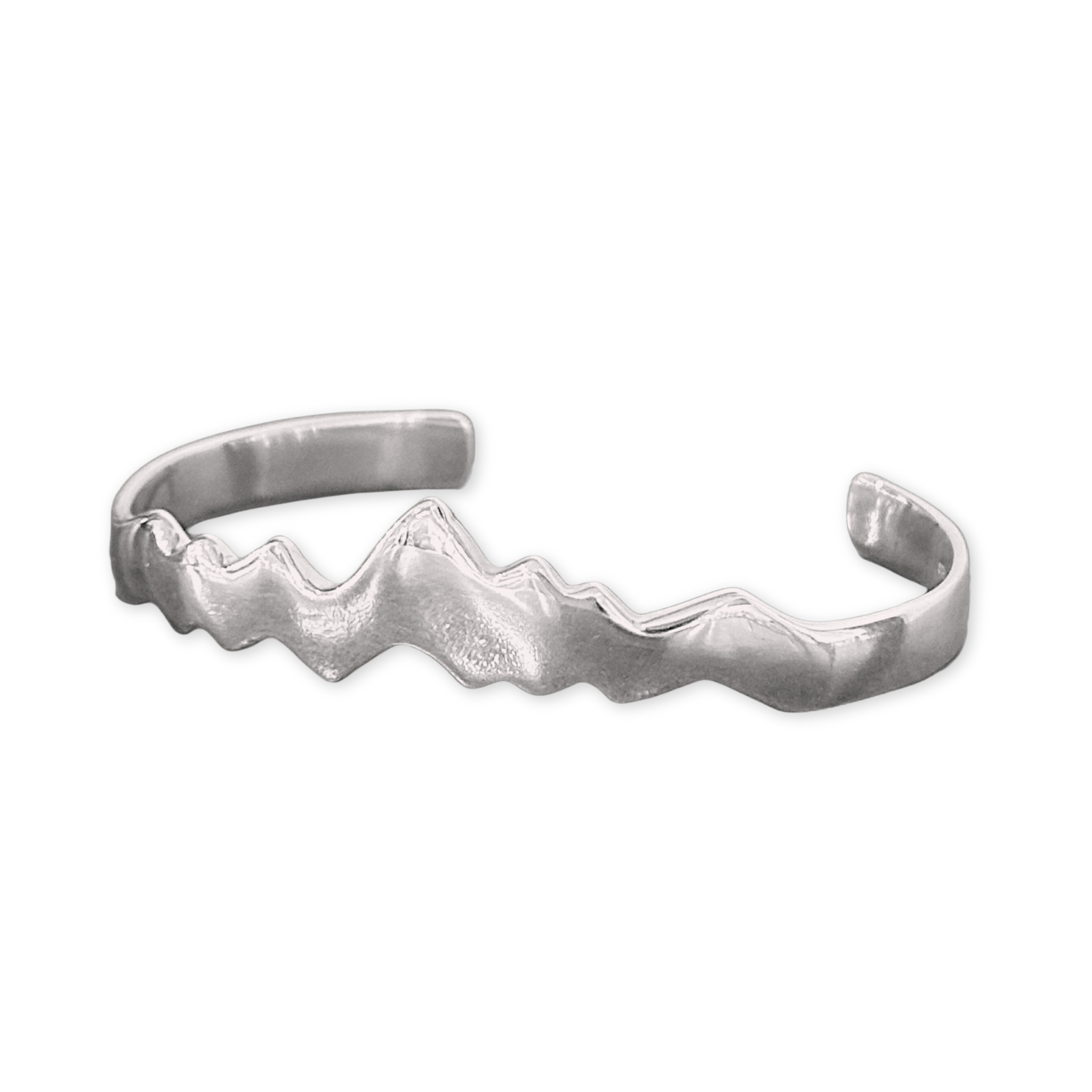 a silver cuff with a mountain range