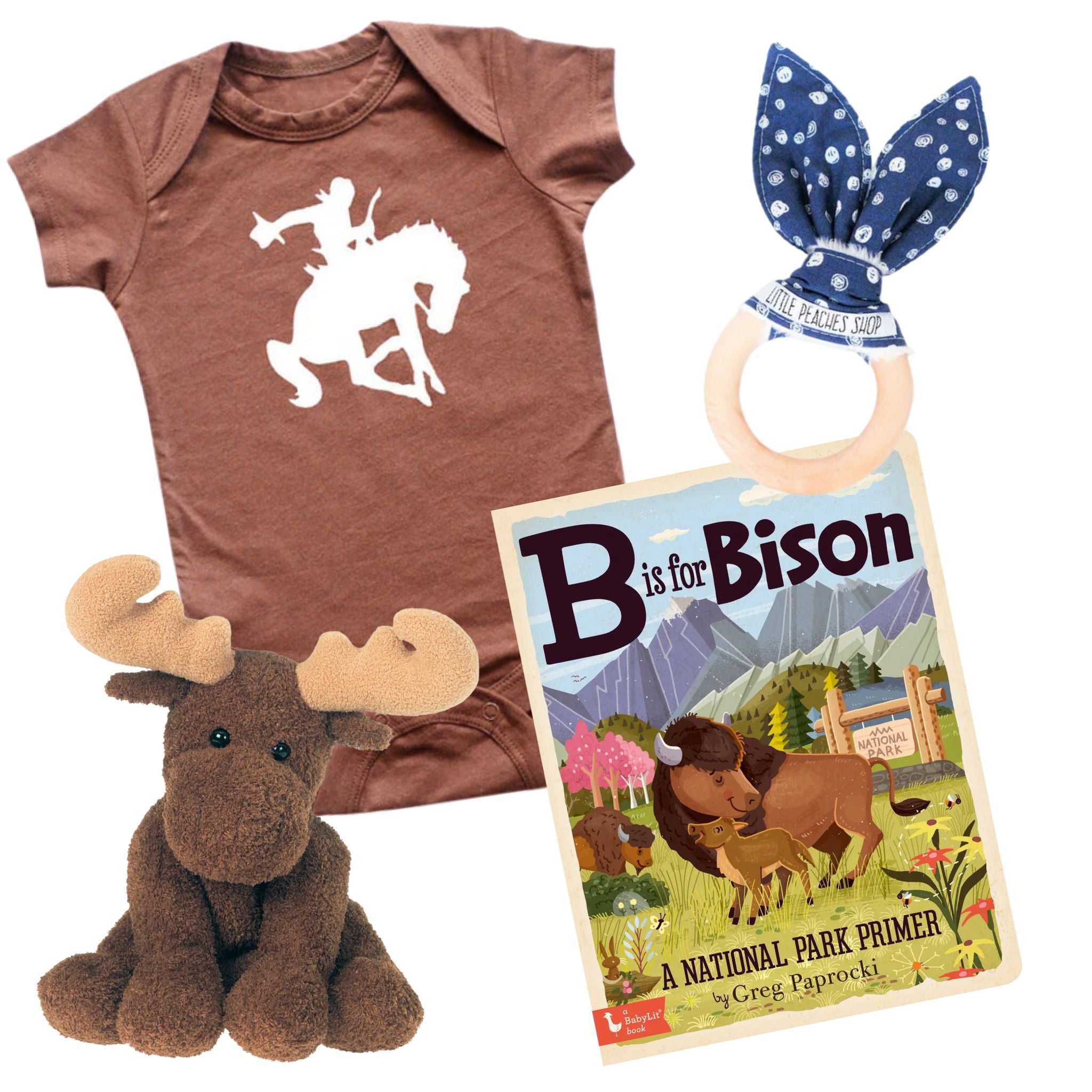 Collection of baby items including a brown onesie with a horse and rider design, a plush moose, a book titled 'B is for Bison', and a blue headband with white polka dots.