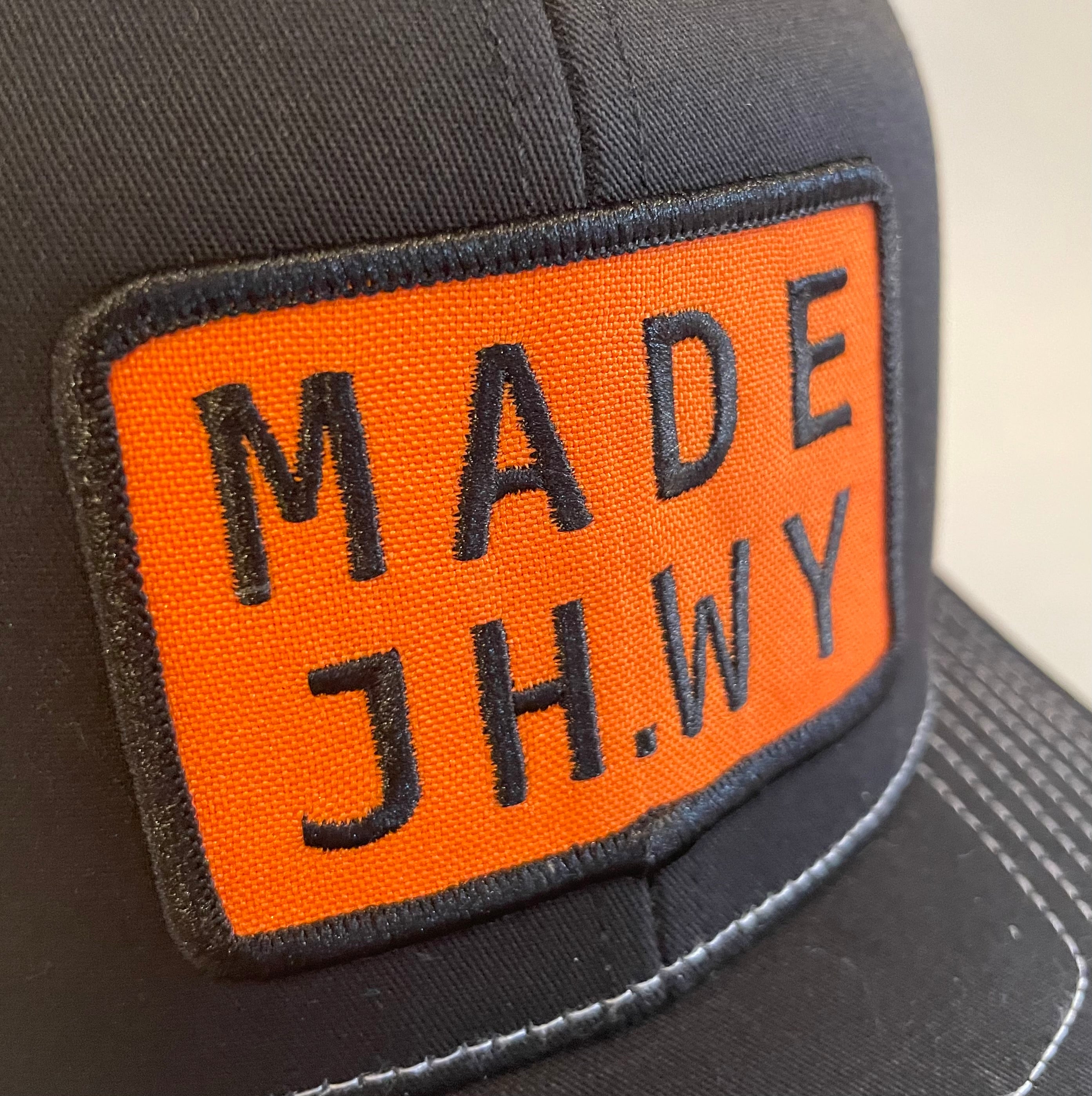 Black and White Mesh MADE JH.WY Trucker Hat
